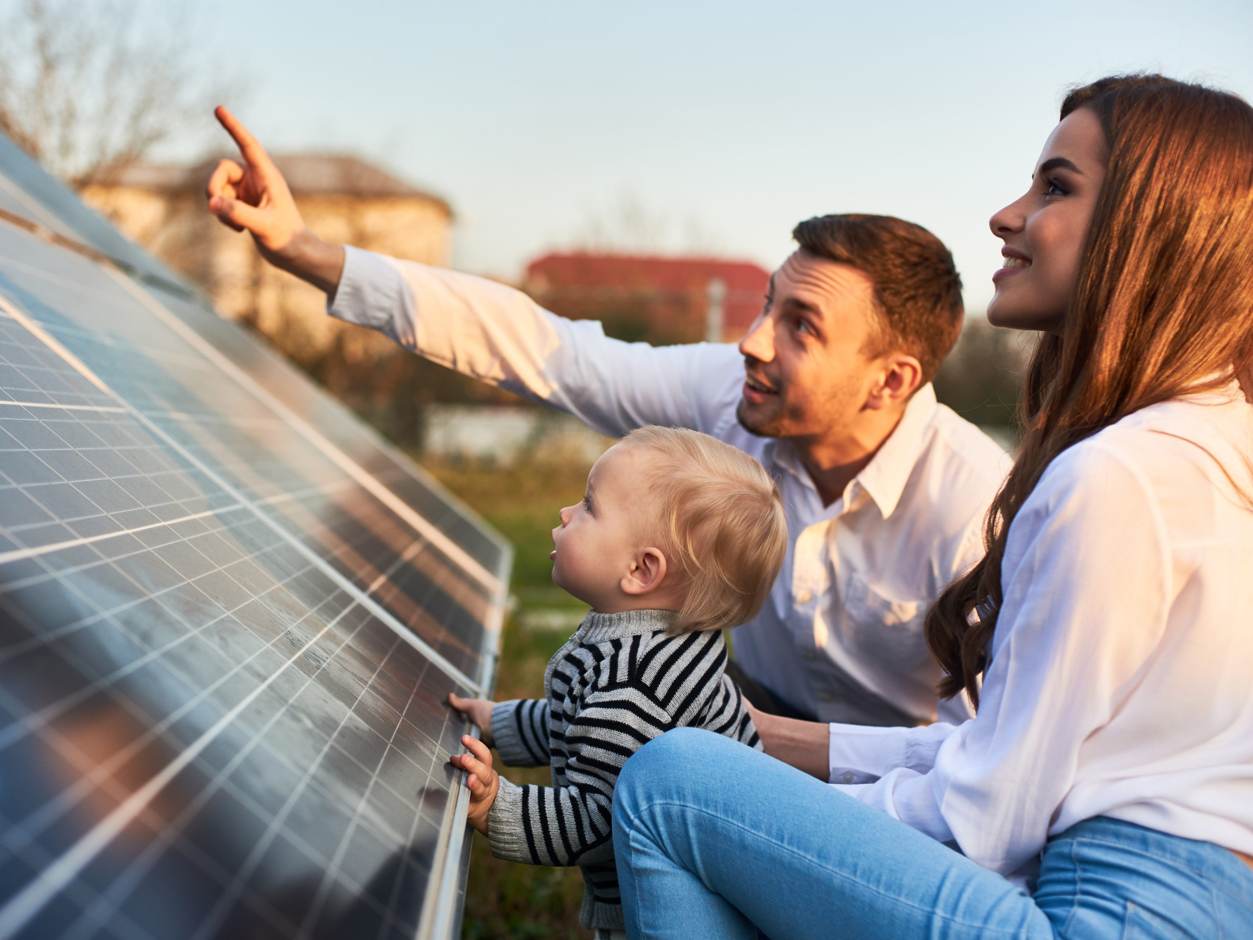 man explains how solar panels work to baby